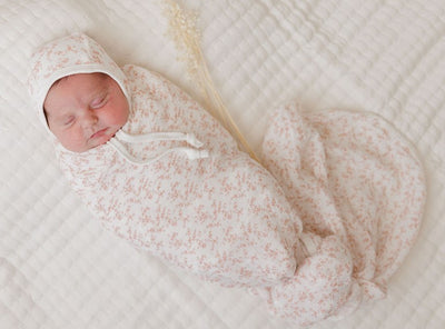 Vine pattern pink on ivory muslin swaddle by Ely's & Co