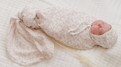 Vine pattern pink on ivory muslin swaddle by Ely's & Co