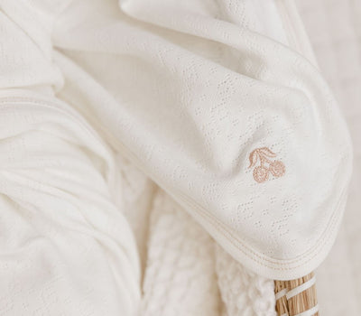 Cherry pointelle ivory/rose gold blanket by Ely's & Co