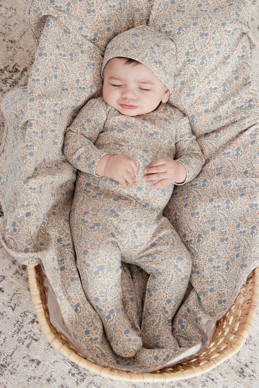 Floral blue footie + hat by Kipp Baby